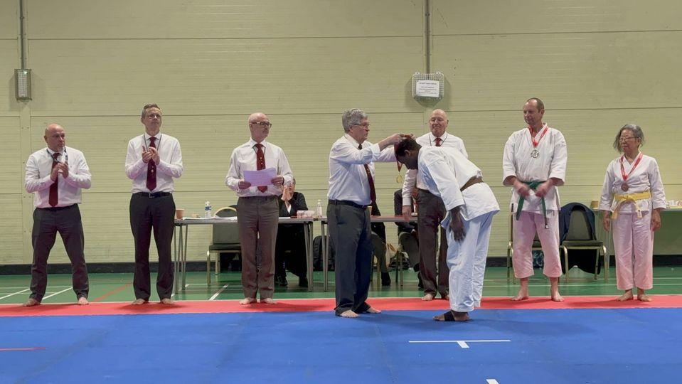 Neville receiving his gold medal at the SW regional competition at Hursley Karate club, March 2024